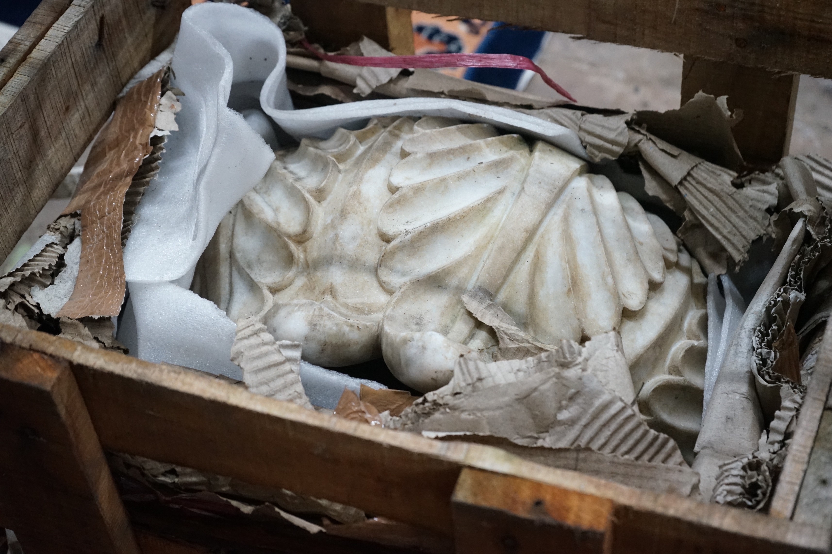 A pair of carved stone acanthus urns, diameter 46cm, height 32cm